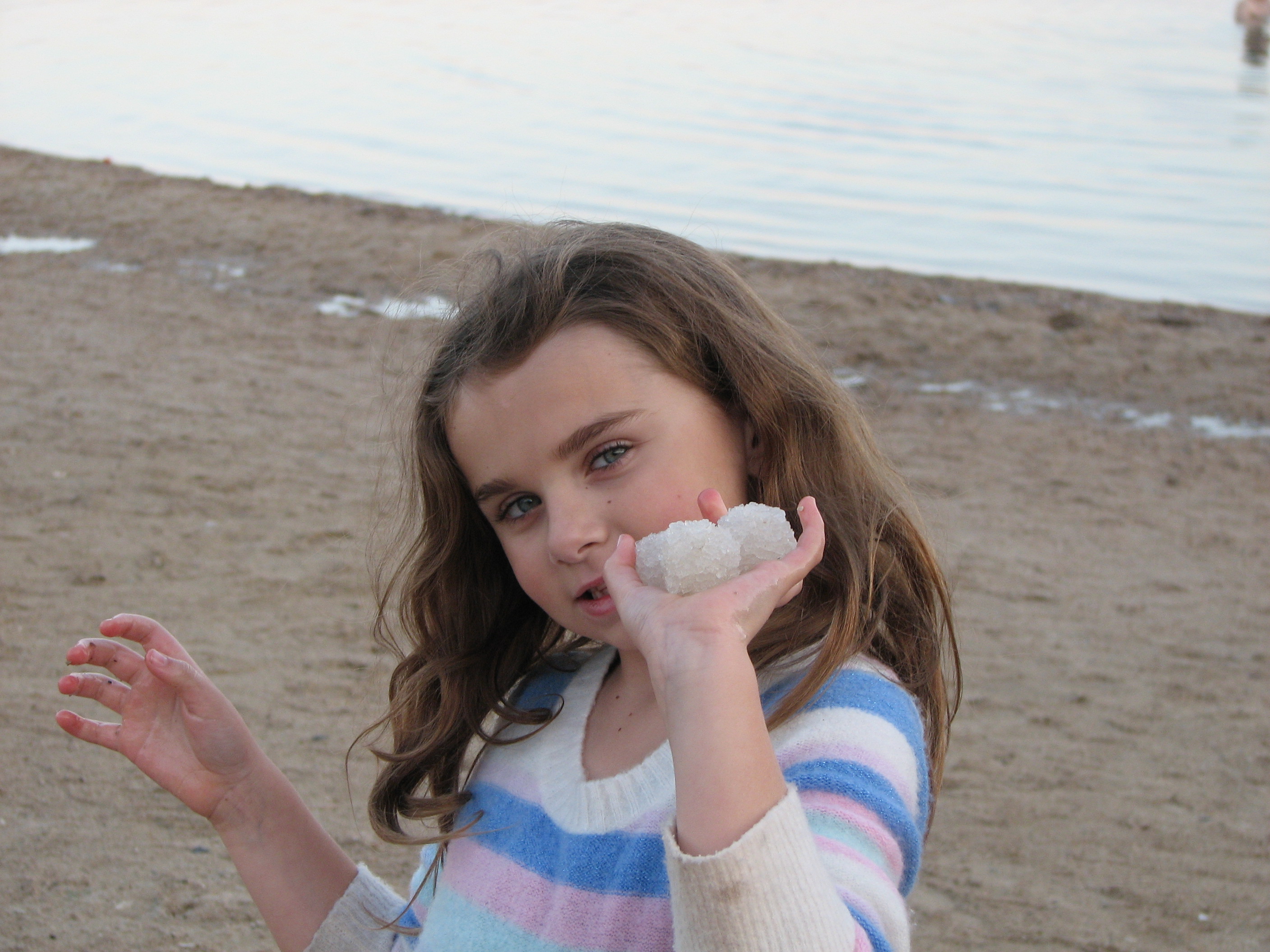 Rachel holding salt crystals at the Dead Sea