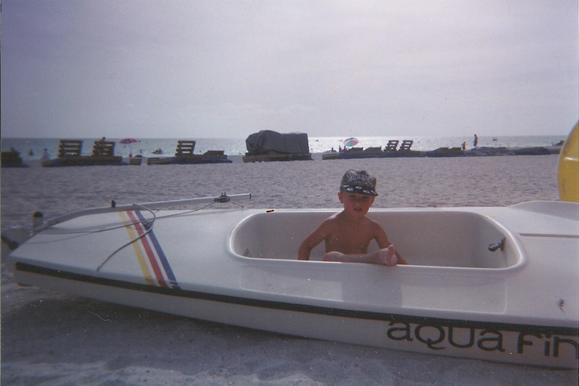 Jacob in boat on the beach