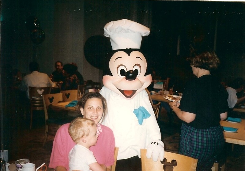 Jacob and mom meets Mickey Mouse at Character Breakfast in Disney World