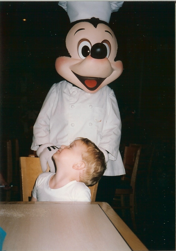 Jacob meets Mickey Mouse at Character Breakfast in Disney World