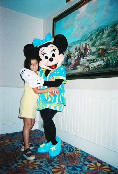 Minnie Mouse gives Anna Van Newkirk a hug