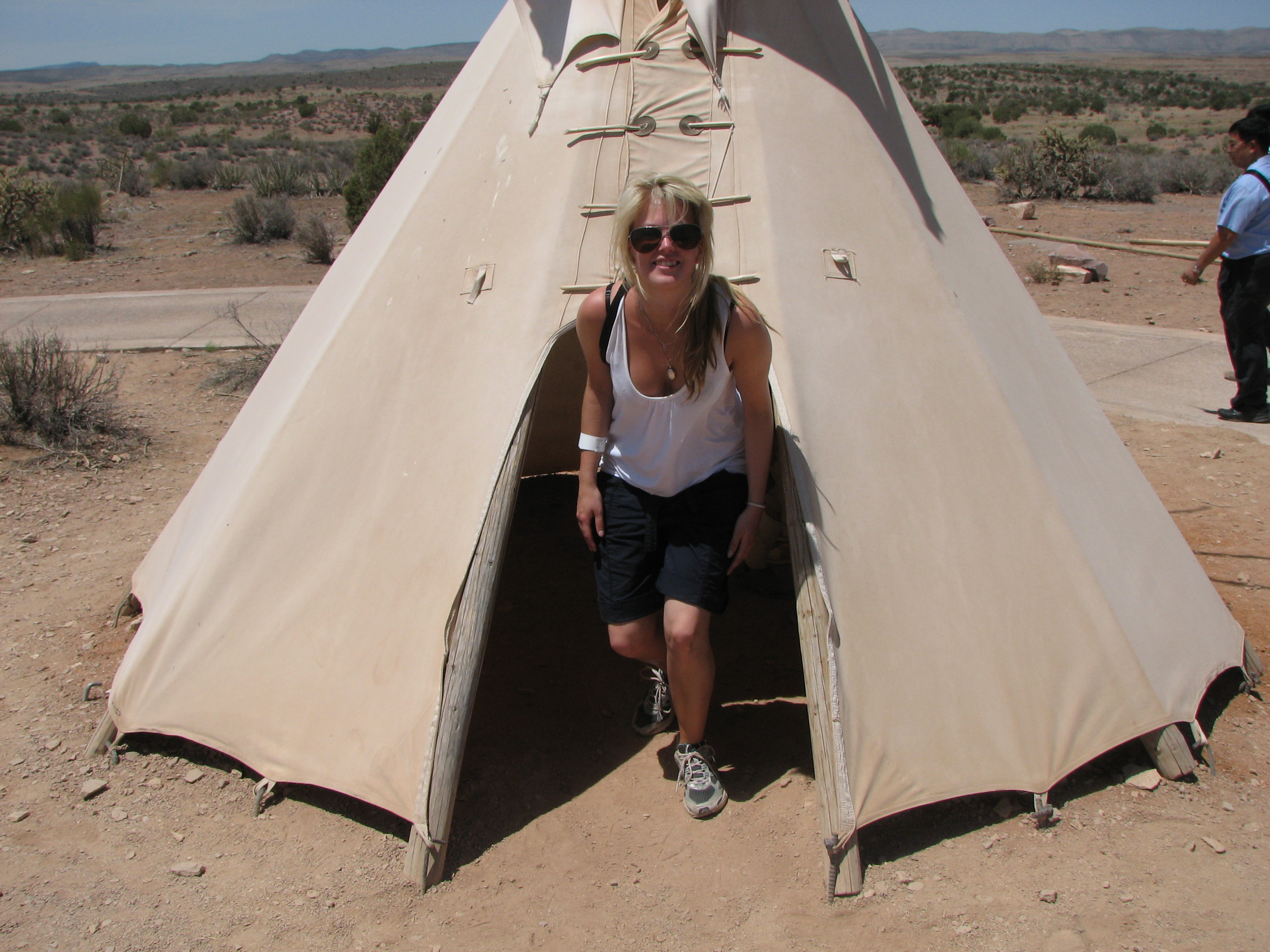 Emelie coming out of a tipi