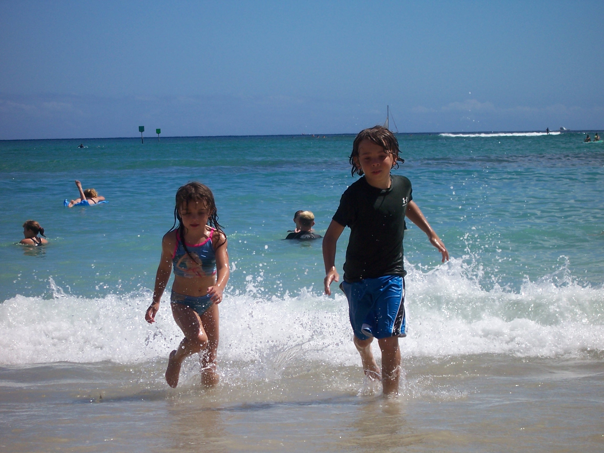 David and Rachel running on the beach.
