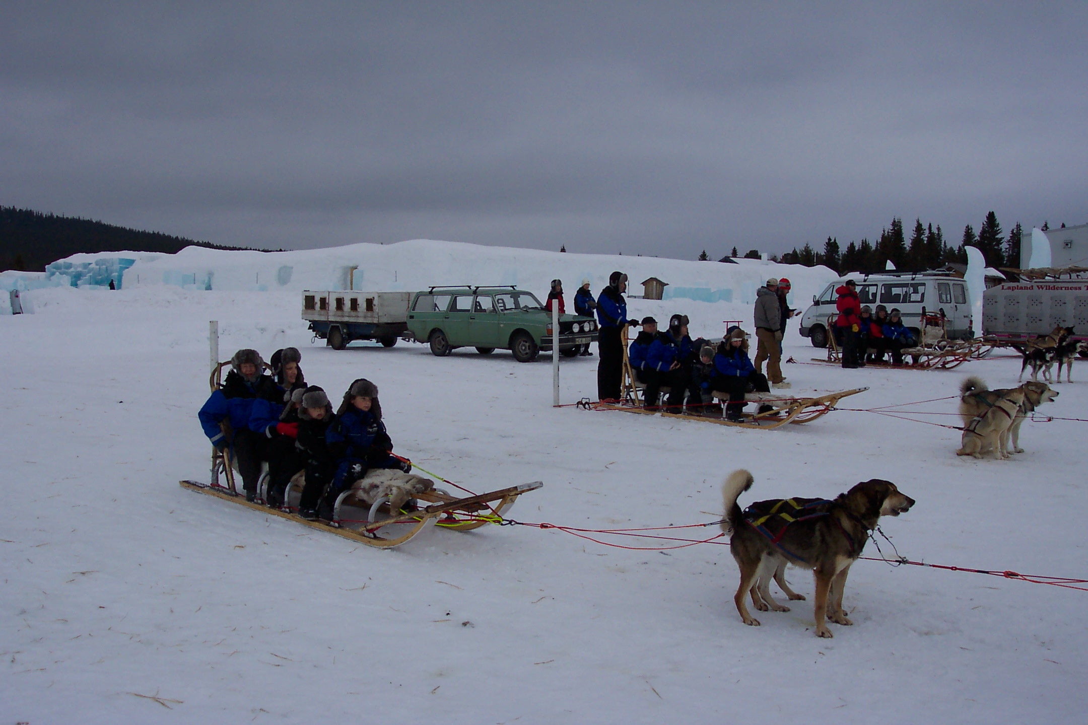 Time for our dog sled tour. Notice the Ice Hotel in the background