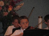 Playing Violin at a School Concert