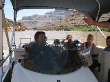 David driving a boat in Colorado River in the Grand Canyon