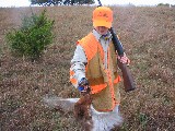 Jacob and another Pheasant. This pheasant is still flapping its wings. Jackson and Jacob went hunting together