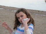 Rachel holding salt crystals at the Dead Sea