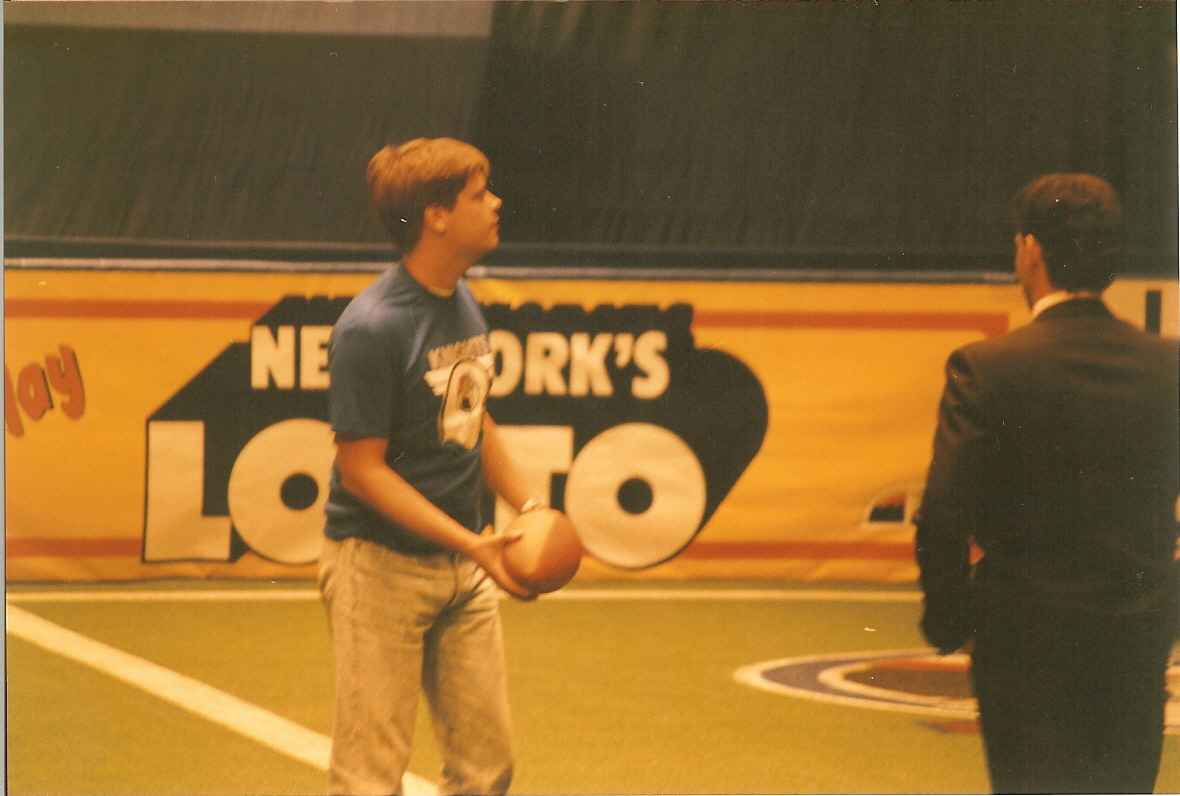Thomas throwing a football at intermission, Madison Square Garden