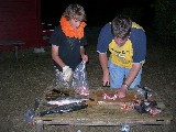 Jacob and Thomas cutting fish in Sweden