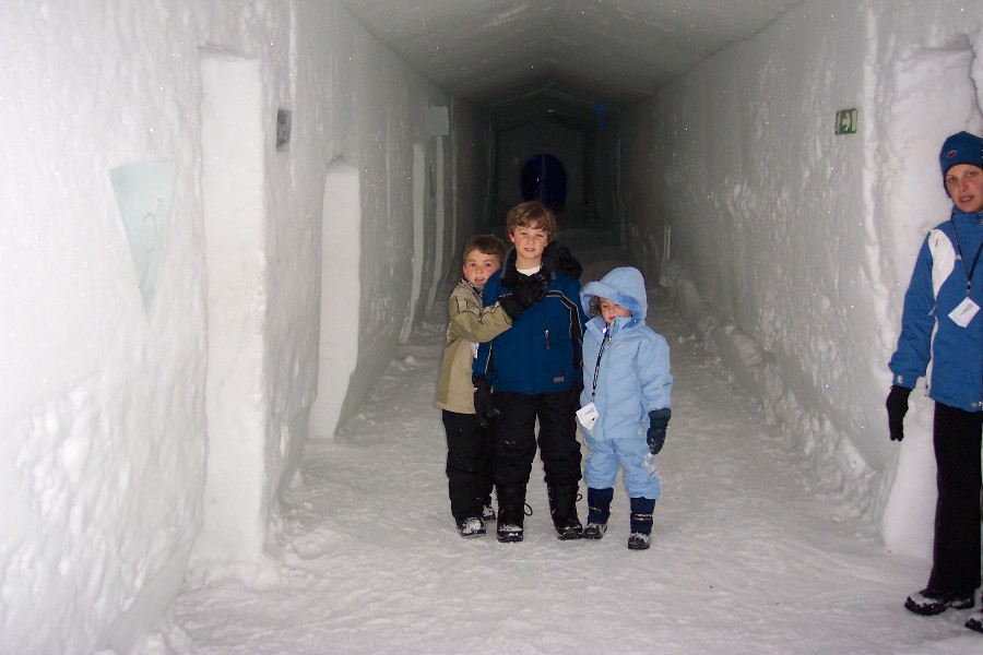 Claudia and the kids in a hallway in the Icehotel