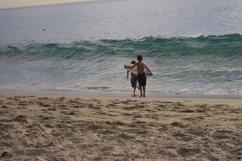 The boys tried to surf the waves at Laguna Beach