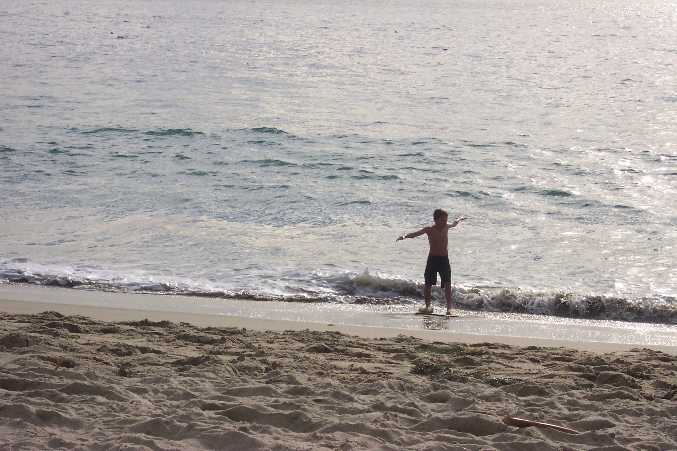 Jacob tried to surf the waves at Laguna Beach, he had some success