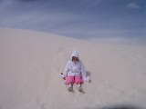 Rachel is playing in a sand dune