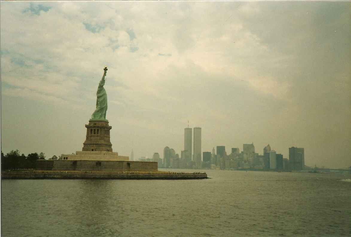 Statue of Liberty and Manhattan. Give me your tired, your poor, your huddled masses yearning to breath free. The wretched refuse of your teeming shore. Send these, the homeless, tempest-tost to me. I lift my lamp beside the golden door.