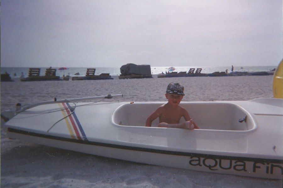 Jacob in boat on the beach