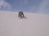 Jacob is climbing a sand dune