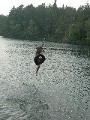 Jacob jumping from a tire into a cool North Swedish lake