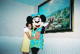 Minnie Mouse gives Anna Van Newkirk a hug